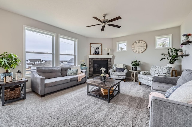 9602 7th St N, Lake Elmo, MN 55042 - living area with ceiling fan, a stone fireplace, and baseboards