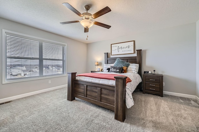 9602 7th St N, Lake Elmo, MN 55042 - carpeted bedroom with baseboards, a textured ceiling, and a ceiling fan