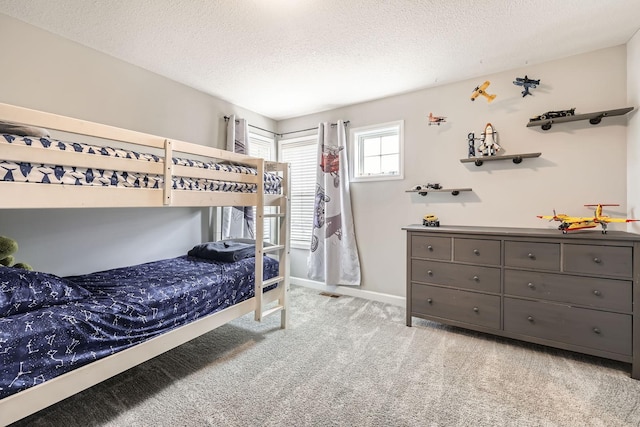 9602 7th St N, Lake Elmo, MN 55042 - carpeted bedroom with a textured ceiling and baseboards