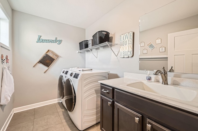 9602 7th St N, Lake Elmo, MN 55042 - laundry room with cabinet space, washing machine and dryer, baseboards, and light tile patterned floors