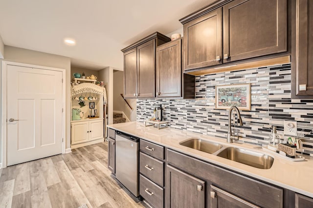 9602 7th St N, Lake Elmo, MN 55042 - kitchen with a sink, light countertops, dark brown cabinets, backsplash, and recessed lighting