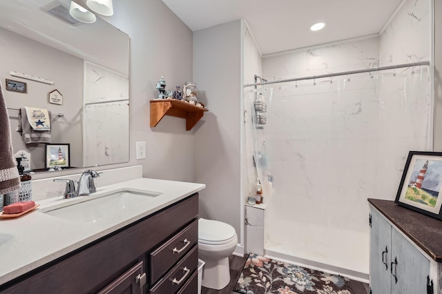 9602 7th St N, Lake Elmo, MN 55042 - bathroom with toilet, tiled shower, vanity, and recessed lighting