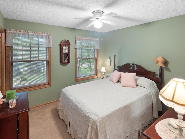 9160 164th Ln NW, Ramsey, MN 55303 - bedroom featuring light colored carpet, a textured ceiling, baseboards, and ceiling fan