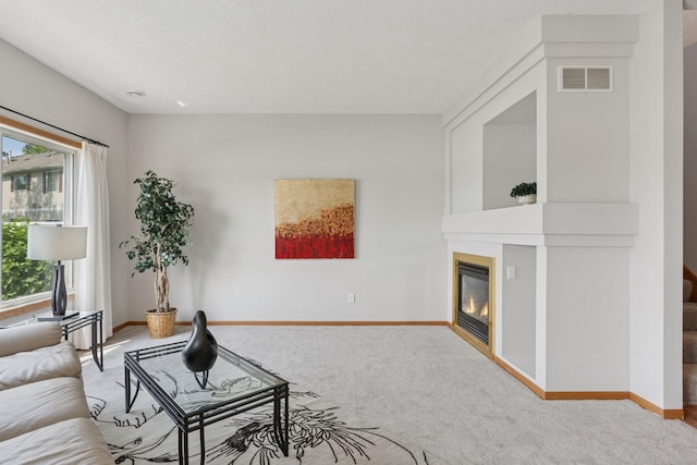 1848 111th Ave NE, Blaine, MN 55449 - carpeted living room with baseboards and a glass covered fireplace