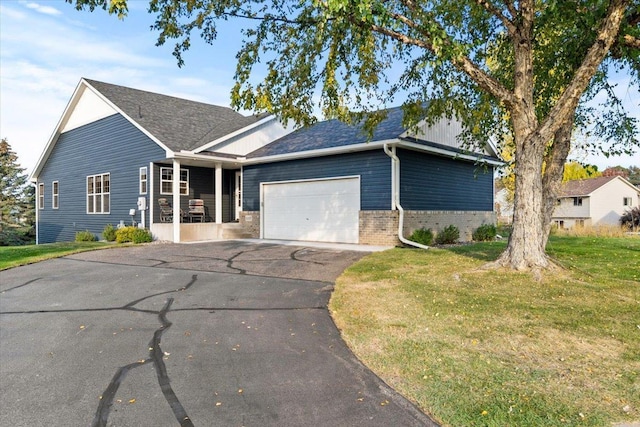 1107 Golden Way NW, Isanti, MN 55040 - view of front of home with driveway, a garage, and a front lawn