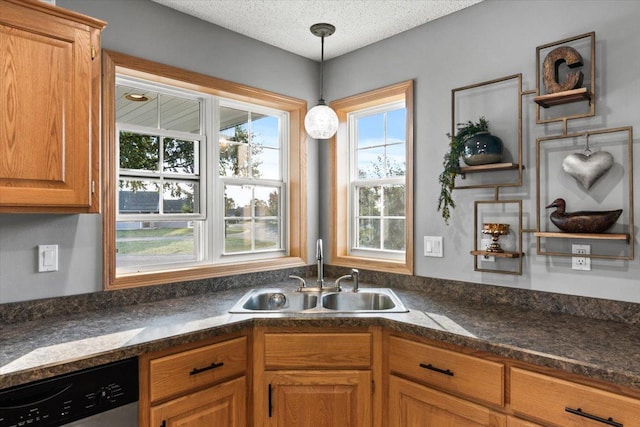 1107 Golden Way NW, Isanti, MN 55040 - kitchen featuring dishwasher, a sink, dark countertops, hanging light fixtures, and brown cabinetry