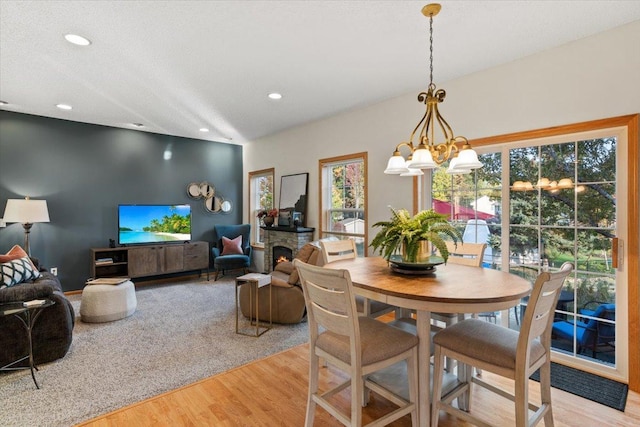 1107 Golden Way NW, Isanti, MN 55040 - dining area featuring light wood-style floors, a chandelier, and recessed lighting