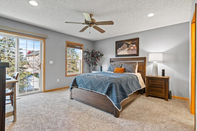 1107 Golden Way NW, Isanti, MN 55040 - bedroom featuring carpet flooring, access to exterior, baseboards, a textured ceiling, and a ceiling fan