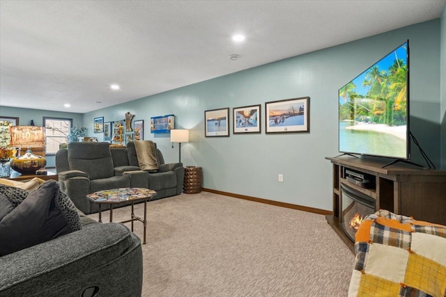 1107 Golden Way NW, Isanti, MN 55040 - carpeted living area featuring baseboards and recessed lighting