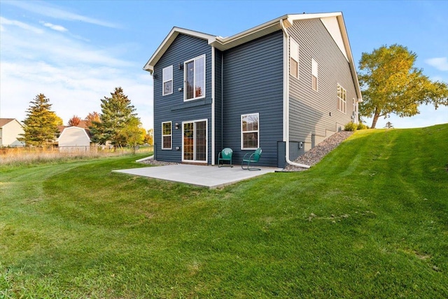 1107 Golden Way NW, Isanti, MN 55040 - back of property featuring a patio area and a yard