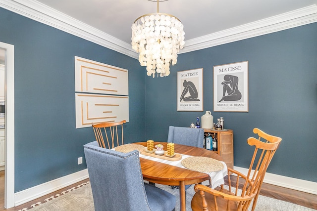 8167 Galway Cir, Woodbury, MN 55125 - dining room with ornamental molding, a chandelier, baseboards, and wood finished floors