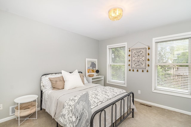 8167 Galway Cir, Woodbury, MN 55125 - bedroom featuring light carpet and baseboards