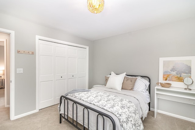 8167 Galway Cir, Woodbury, MN 55125 - bedroom featuring light carpet, baseboards, and a closet