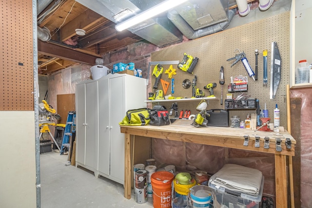 8167 Galway Cir, Woodbury, MN 55125 - miscellaneous room with concrete flooring and a workshop area