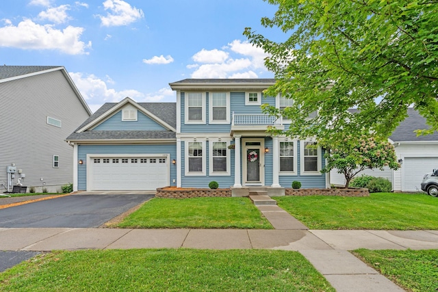 11230 68th St NE, Albertville, MN 55301 - view of front of home with asphalt driveway, an attached garage, and a front lawn