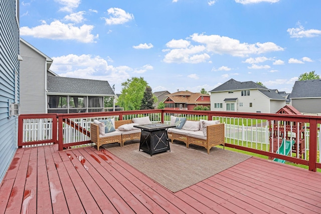11230 68th St NE, Albertville, MN 55301 - wooden terrace featuring an outdoor living space with a fire pit, a sunroom, and a residential view