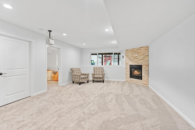 11230 68th St NE, Albertville, MN 55301 - sitting room with carpet flooring, a stone fireplace, and recessed lighting