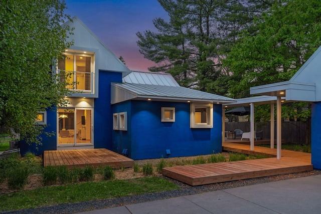 303 77th St, Chanhassen, MN 55317 - contemporary home with a wooden deck, a standing seam roof, metal roof, and stucco siding