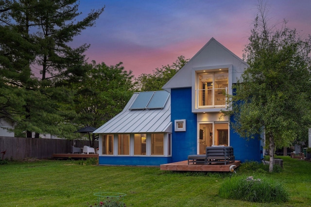 303 77th St, Chanhassen, MN 55317 - rear view of property with a standing seam roof, a deck, and metal roof