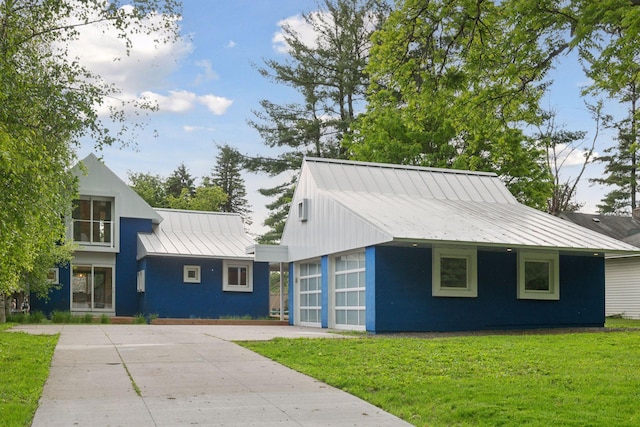 303 77th St, Chanhassen, MN 55317 - view of front of home with a front lawn, metal roof, and a standing seam roof