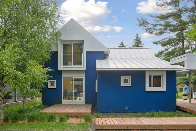303 77th St, Chanhassen, MN 55317 - back of house with a standing seam roof, metal roof, a deck, and stucco siding