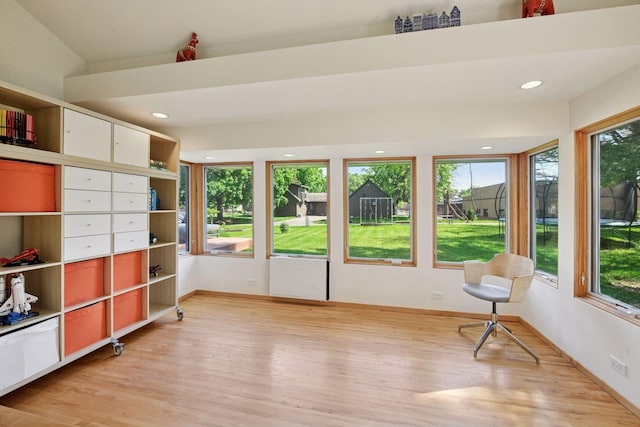 303 77th St, Chanhassen, MN 55317 - unfurnished sunroom featuring wood finished floors, plenty of natural light, baseboards, and recessed lighting