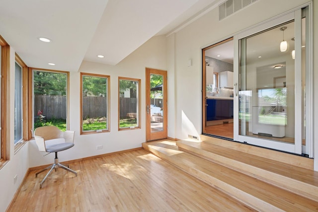 303 77th St, Chanhassen, MN 55317 - unfurnished sunroom with wood-type flooring, baseboards, recessed lighting, and vaulted ceiling