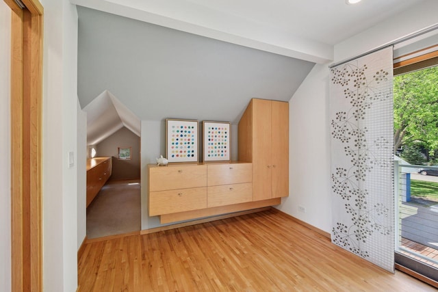 303 77th St, Chanhassen, MN 55317 - unfurnished bedroom with lofted ceiling and light wood finished floors