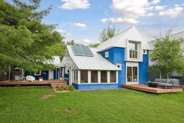 303 77th St, Chanhassen, MN 55317 - rear view of property featuring a standing seam roof, an outdoor living space, metal roof, a sunroom, and a deck