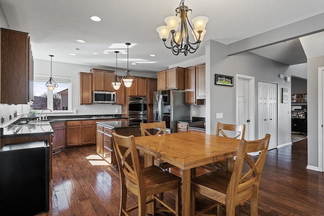 3297 Thornton Dr SW, Prior Lake, MN 55372 - dining area with dark wood-style flooring, a chandelier, and recessed lighting