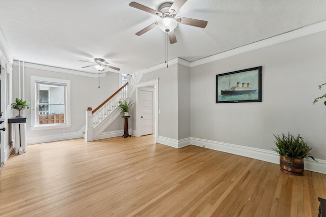 1744 Marshall Ave, Saint Paul, MN 55104 - unfurnished living room with a ceiling fan, light wood-style floors, stairway, baseboards, and ornamental molding