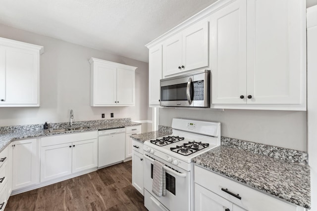 1744 Marshall Ave, Saint Paul, MN 55104 - kitchen featuring white appliances, a sink, dark wood-type flooring, and white cabinets