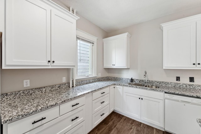 1744 Marshall Ave, Saint Paul, MN 55104 - kitchen with white dishwasher, a sink, white cabinetry, dark wood-style flooring, and light stone countertops