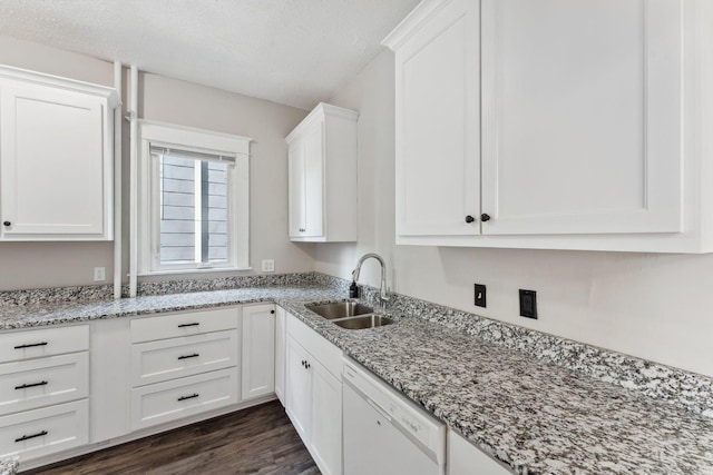1744 Marshall Ave, Saint Paul, MN 55104 - kitchen with white dishwasher, a sink, white cabinetry, dark wood finished floors, and light stone counters
