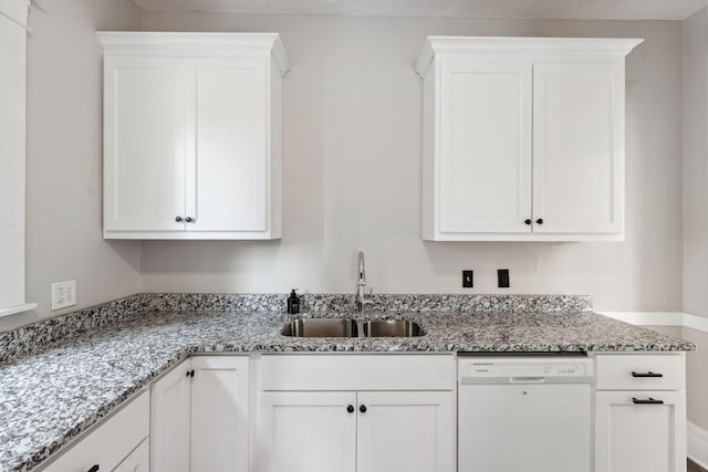 1744 Marshall Ave, Saint Paul, MN 55104 - kitchen featuring dishwasher, a sink, white cabinets, and light stone counters