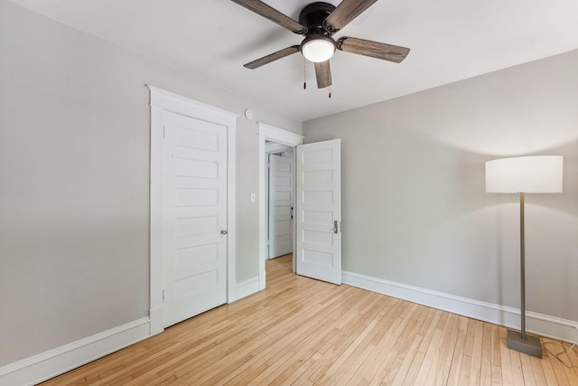 1744 Marshall Ave, Saint Paul, MN 55104 - unfurnished bedroom featuring baseboards, hardwood / wood-style flooring, and a ceiling fan