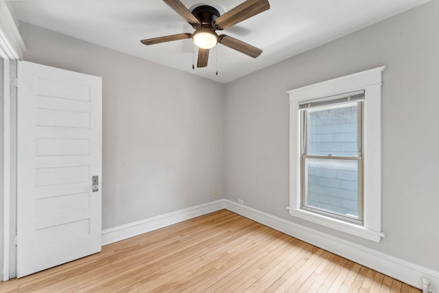 1744 Marshall Ave, Saint Paul, MN 55104 - unfurnished room featuring hardwood / wood-style flooring, baseboards, and ceiling fan