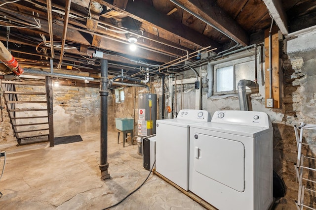 1744 Marshall Ave, Saint Paul, MN 55104 - basement featuring washing machine and clothes dryer, gas water heater, and a sink