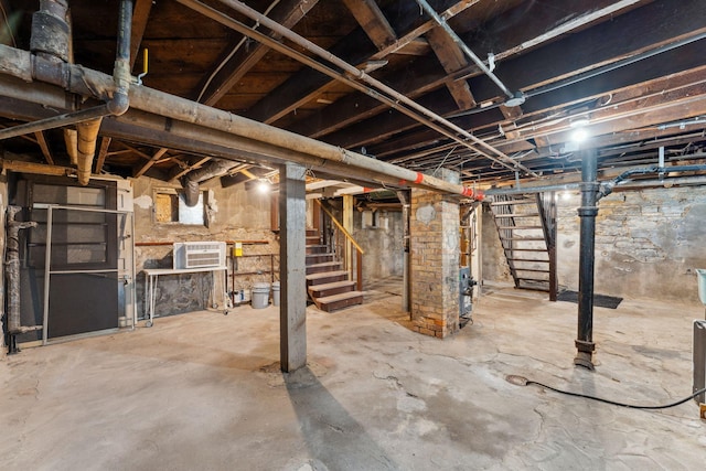 1744 Marshall Ave, Saint Paul, MN 55104 - unfinished basement featuring stairway and an AC wall unit