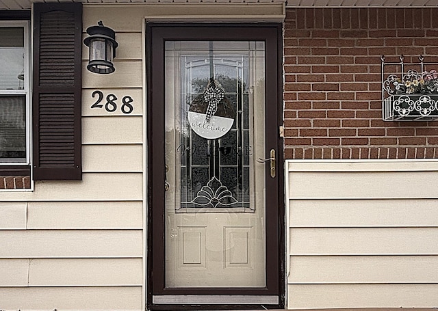 288 Locust St, Dawson, MN 56232 - property entrance with brick siding