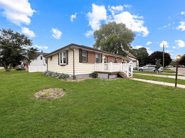 288 Locust St, Dawson, MN 56232 - view of side of property with a yard and a deck