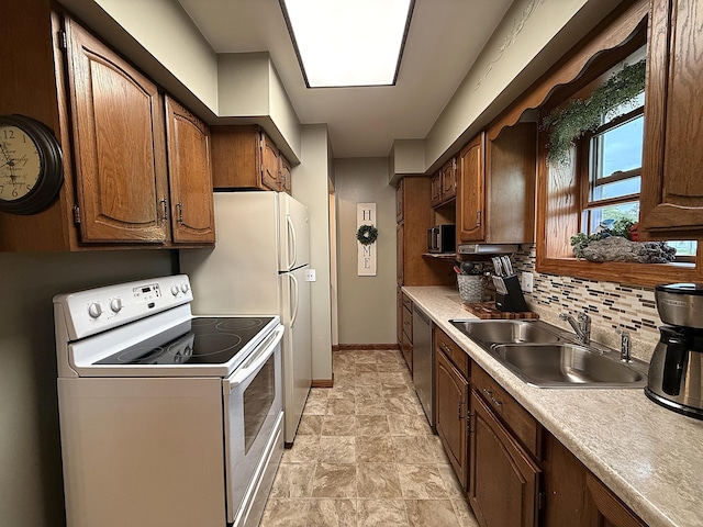 288 Locust St, Dawson, MN 56232 - kitchen featuring white appliances, a sink, baseboards, backsplash, and light countertops