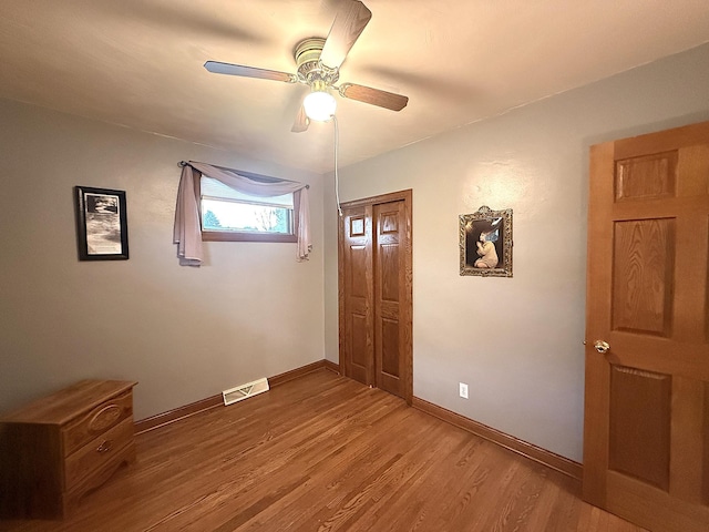 288 Locust St, Dawson, MN 56232 - entryway featuring ceiling fan, wood finished floors, and baseboards