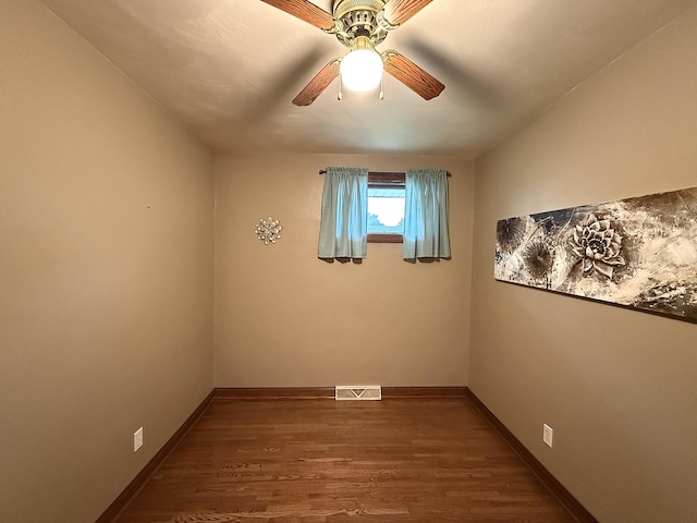 288 Locust St, Dawson, MN 56232 - spare room featuring wood finished floors, ceiling fan, and baseboards