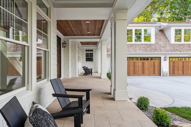 2475 Dunwoody Ave, Orono, MN 55391 - view of patio / terrace featuring driveway and an attached garage