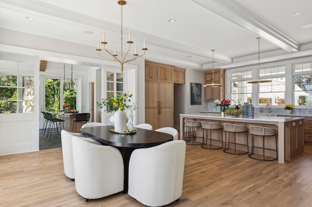 2475 Dunwoody Ave, Orono, MN 55391 - dining space with a chandelier, healthy amount of natural light, light wood finished floors, crown molding, and beamed ceiling