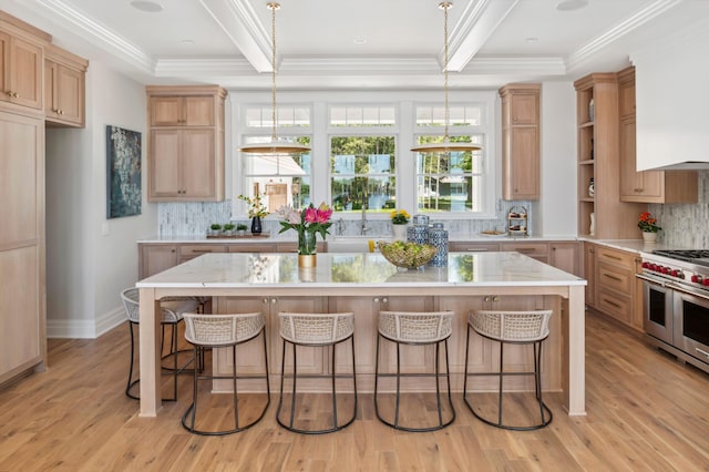 2475 Dunwoody Ave, Orono, MN 55391 - kitchen featuring double oven range, light wood-style floors, decorative backsplash, a kitchen breakfast bar, and crown molding