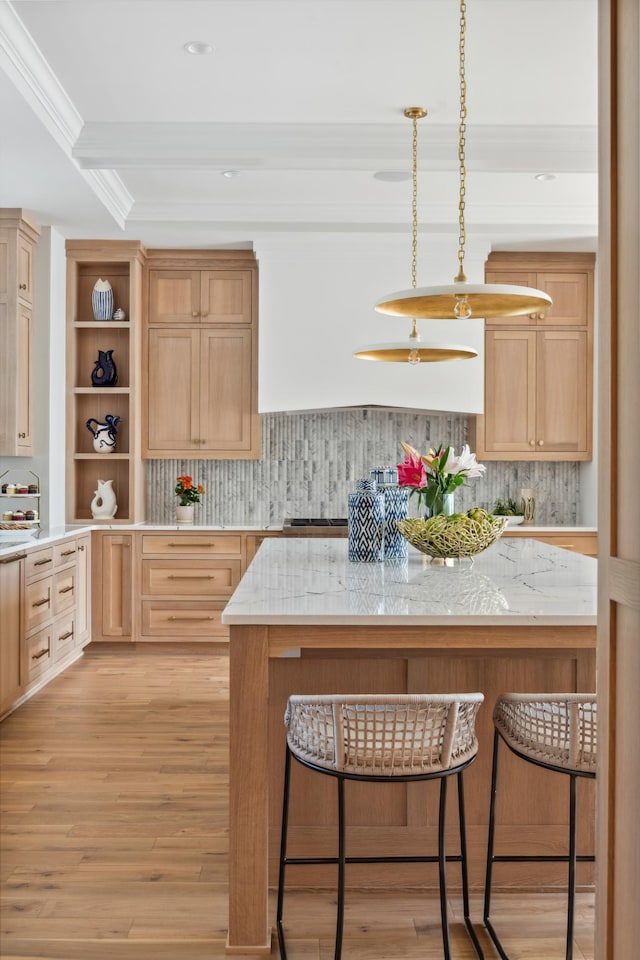 2475 Dunwoody Ave, Orono, MN 55391 - kitchen featuring a kitchen breakfast bar, light brown cabinetry, backsplash, light wood-style floors, and ornamental molding