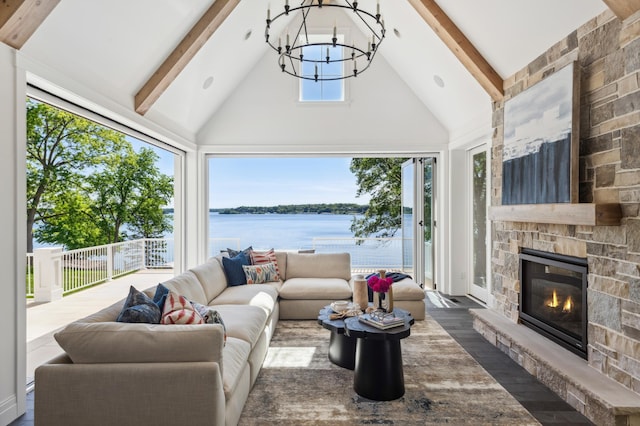 2475 Dunwoody Ave, Orono, MN 55391 - living area featuring a water view, high vaulted ceiling, a chandelier, beamed ceiling, and a fireplace