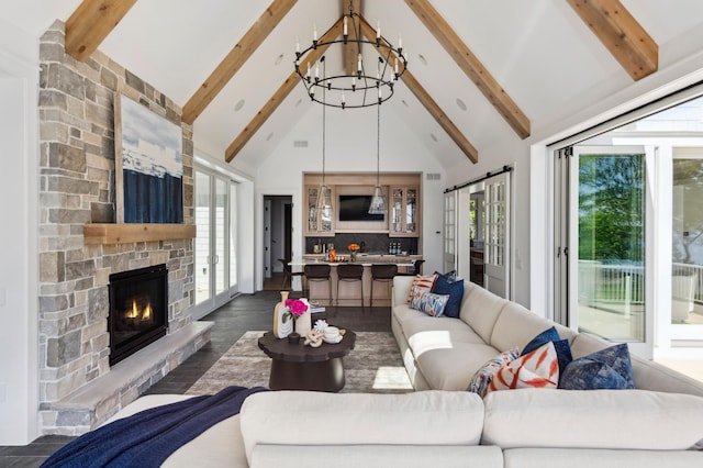 2475 Dunwoody Ave, Orono, MN 55391 - living area featuring high vaulted ceiling, a chandelier, healthy amount of natural light, beamed ceiling, and a stone fireplace